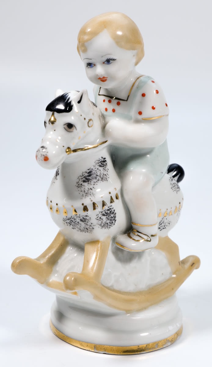 Статуэтка "Мальчик на лошадке"("юный буденовец"), СССР, 1960-е гг., Киевский экспериментальный керамико-художественный завод (КЭКХЗ), автор С.В. Голембовская-Болзан., фарфор, надглазурная полихромная роспись, цировка золотом. Высота 16 см. - Без автора