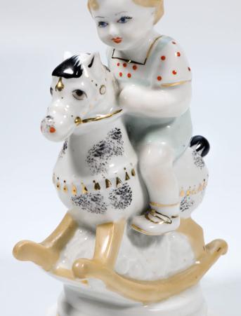 Статуэтка "Мальчик на лошадке"("юный буденовец"), СССР, 1960-е гг., Киевский экспериментальный керамико-художественный завод (КЭКХЗ), автор С.В. Голембовская-Болзан., фарфор, надглазурная полихромная роспись, цировка золотом. Высота 16 см.